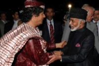 مع الرئيس الليبي السابق معمر القذافي 